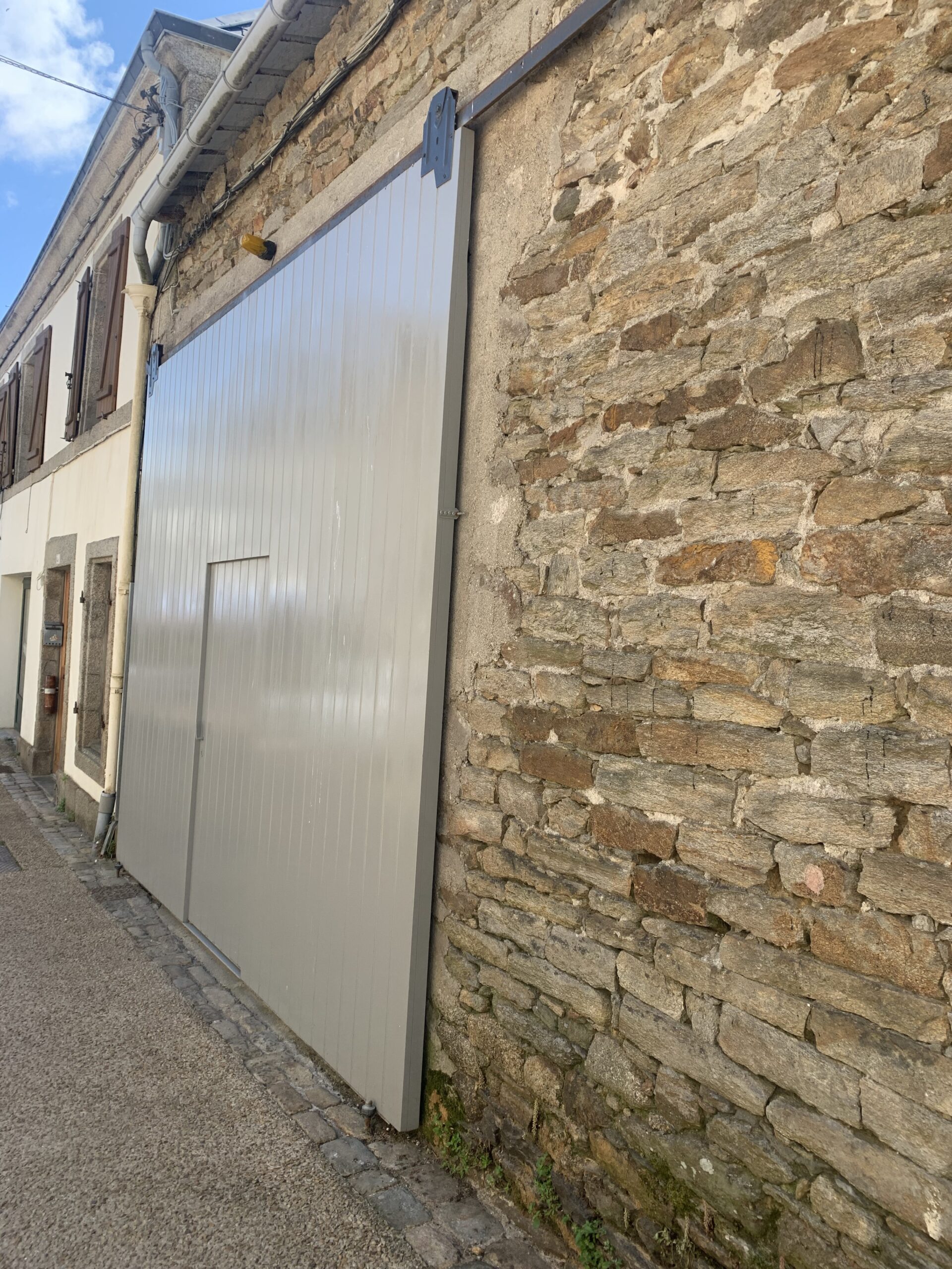 Porte garage deplacement lateral
